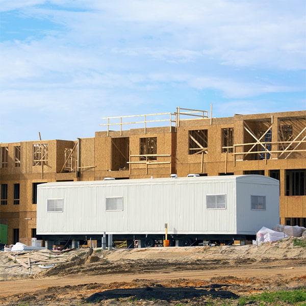 construction site office trailers are typically delivered and installed by professionals using specialized equipment and methods